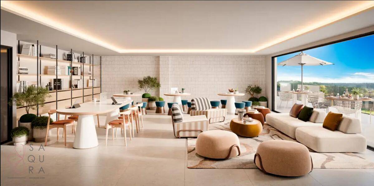 Heller und geräumiger Gemeinschaftsraum mit Lounge-Möbeln, Tischen und Bücherregalen.