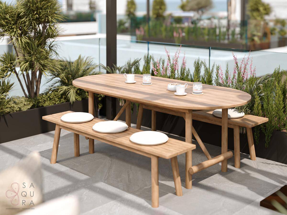 Gemütlicher Essbereich auf der Dachterrasse mit Holztisch und Bänken, umgeben von Pflanzen.