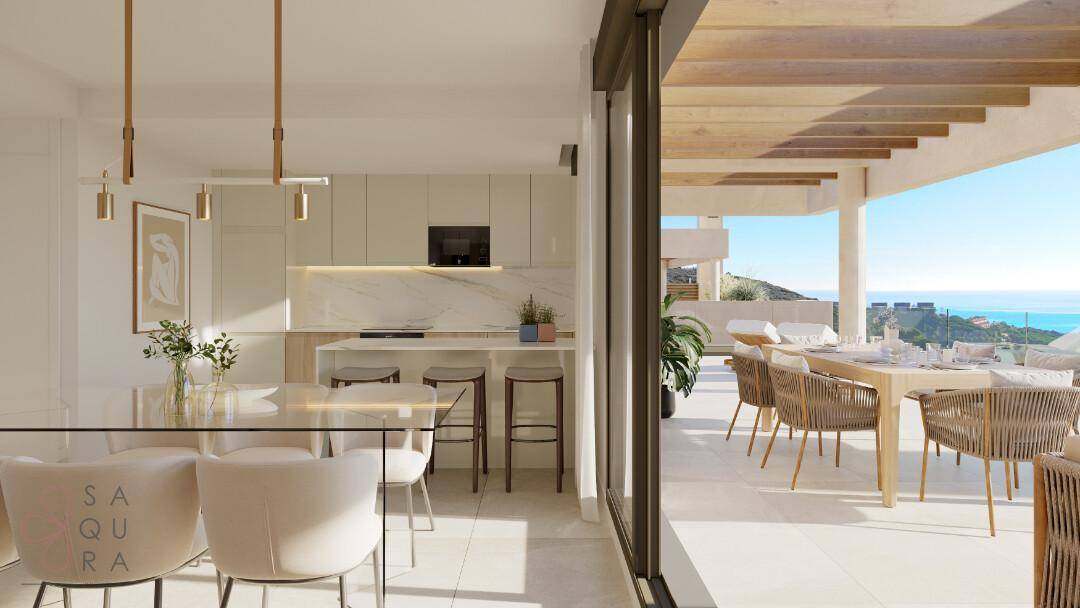 Moderne offene Küche mit Essbereich und direktem Zugang zu einer Terrasse mit Meerblick.