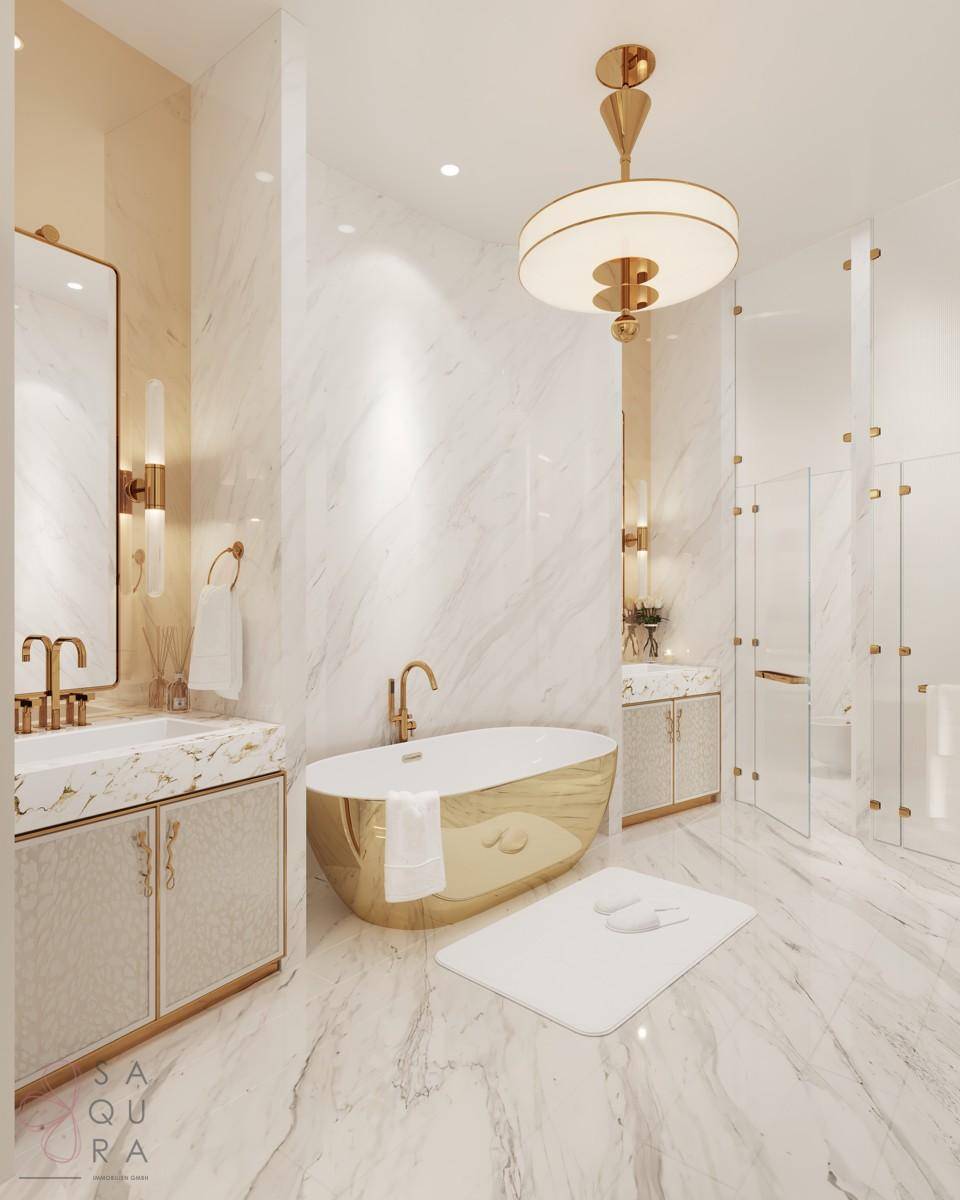 Exklusives Badezimmer mit freistehender goldener Badewanne, Marmoroberflächen und moderner Duschkabine.
