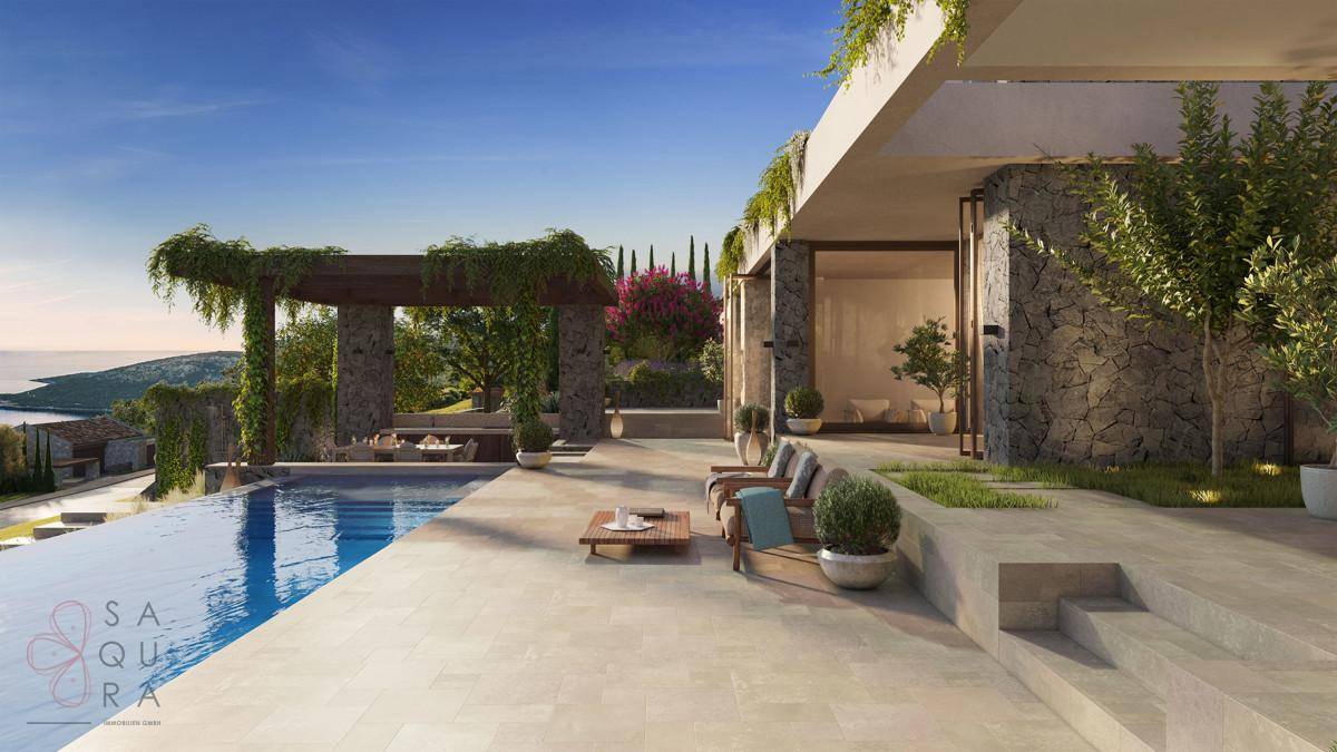 Weitläufige Poolterrasse mit Infinity-Pool und Lounge-Bereichen, umgeben von mediterraner Vegetation.