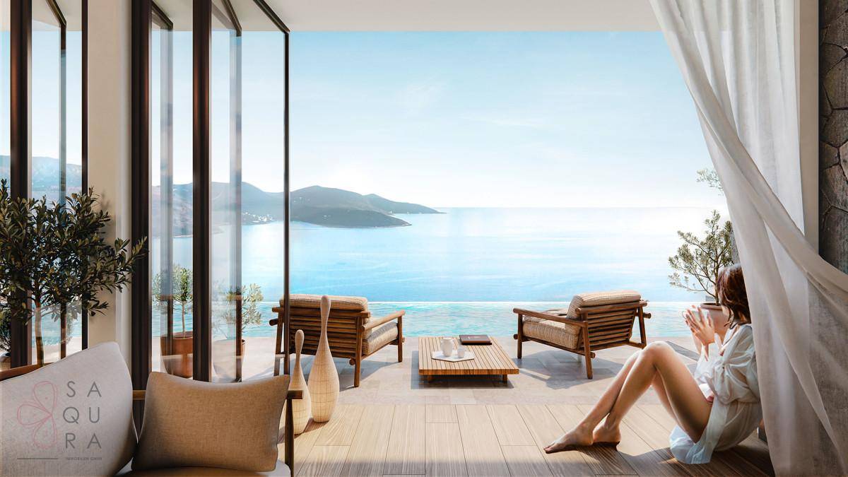 Gemütlicher Wohnbereich mit Meerblick und Zugang zu einer privaten Terrasse.