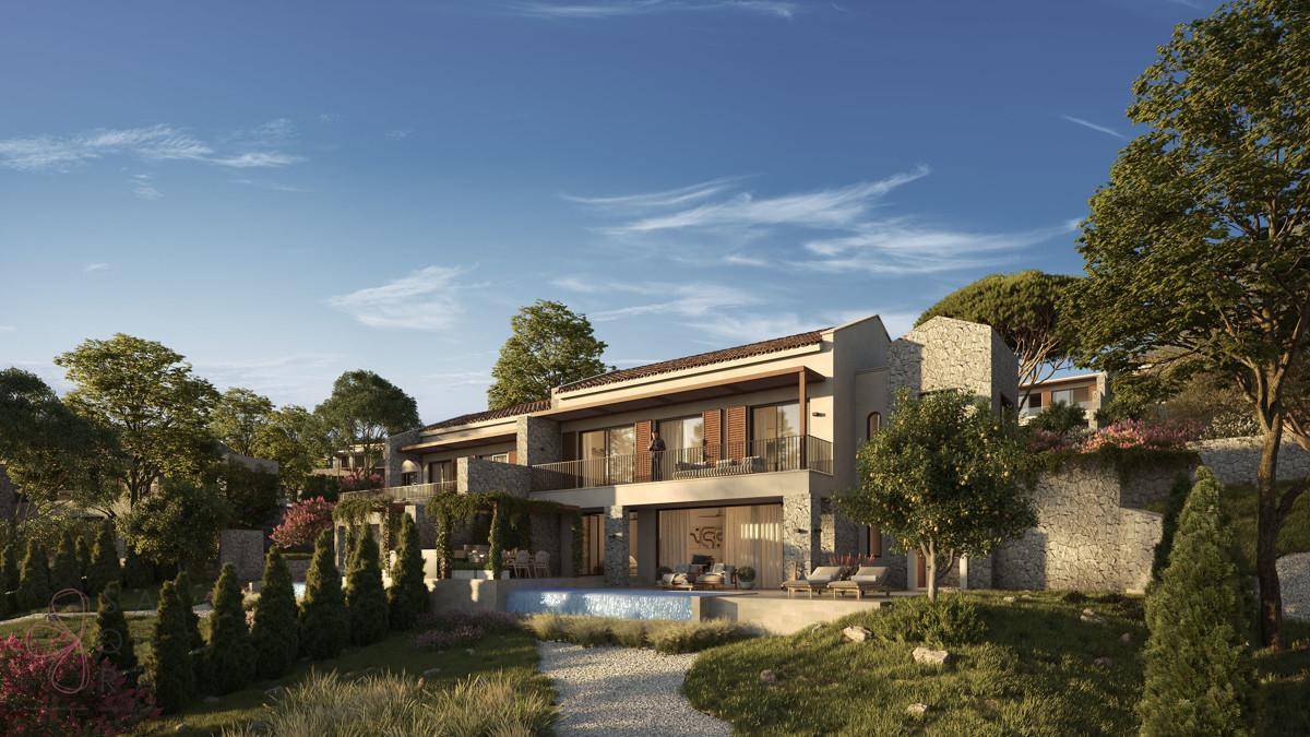 Elegante Villa mit traditioneller Architektur, Steinmauern und gepflegtem Gartenbereich.
