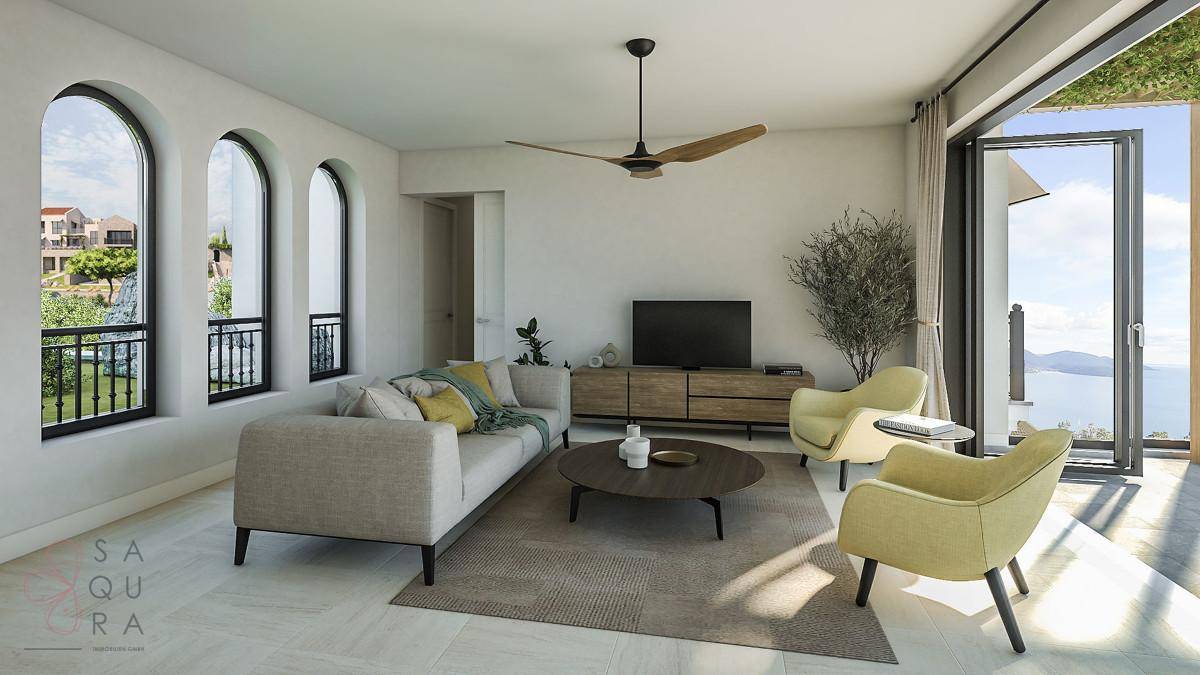 Helles Wohnzimmer mit Bogenfenstern, Meerblick und modernem Mobiliar.