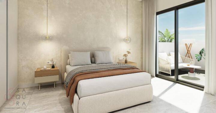 Gemütliches Schlafzimmer mit großem Bett, modernen Hängelampen und Zugang zu einer Terrasse.