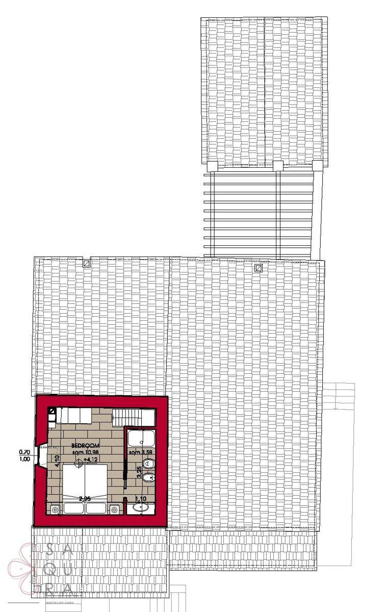 Grundriss des Dachgeschosses mit Schlafzimmer und Badezimmer, zeigt die Raumaufteilung.