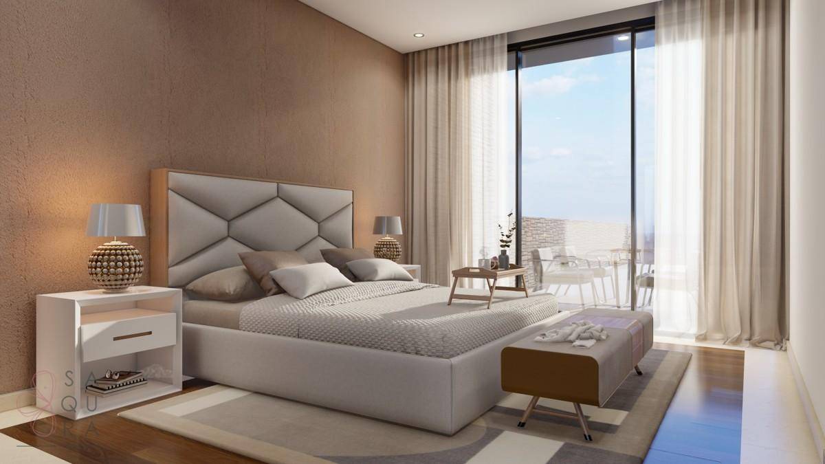 Modernes Schlafzimmer mit großem Bett, Nachttischen und Zugang zu einer privaten Terrasse.