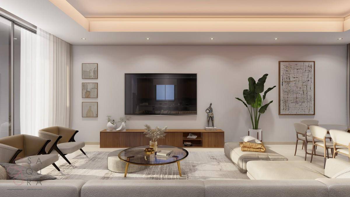 Modernes Wohnzimmer mit großem Sofa, Fernseher und stilvoller Dekoration.