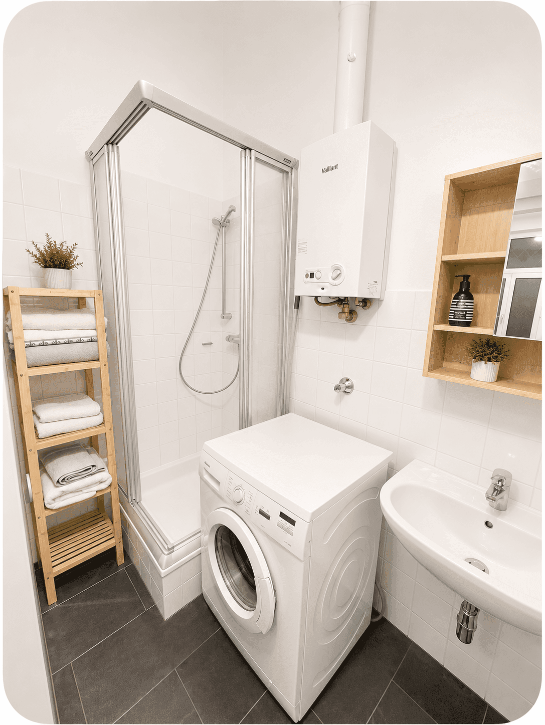 Modernes Badezimmer mit Duschkabine, Waschmaschine und Waschbecken.