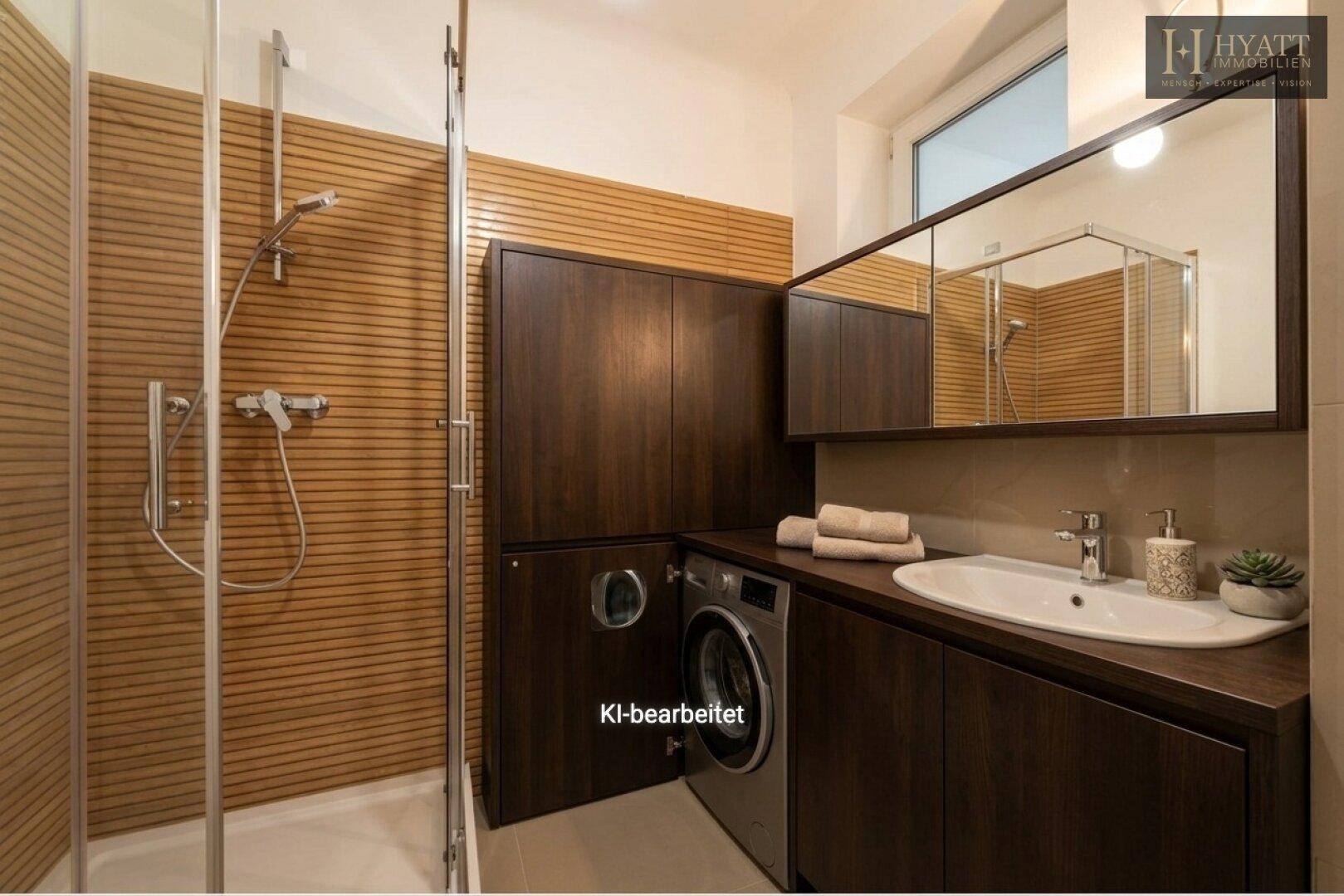 Modernes Badezimmer mit begehbarer Dusche, Waschbecken und integrierter Waschmaschine.