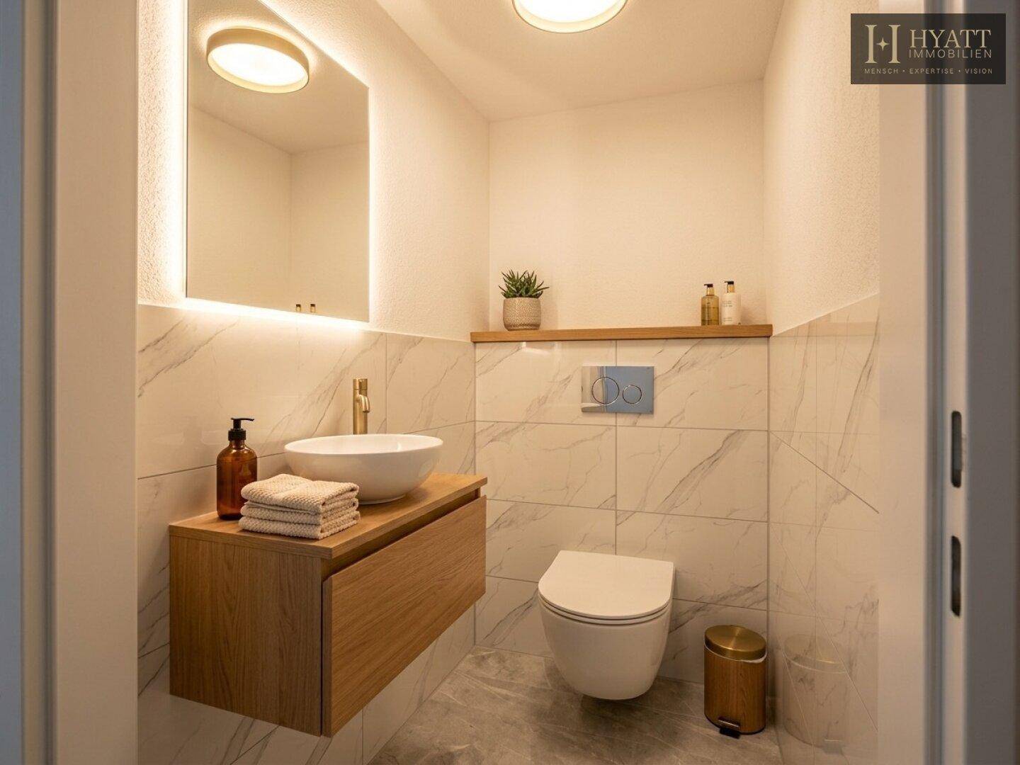 Elegantes Gäste-WC mit modernem Waschbecken, Wand-WC und beleuchtetem Spiegel.