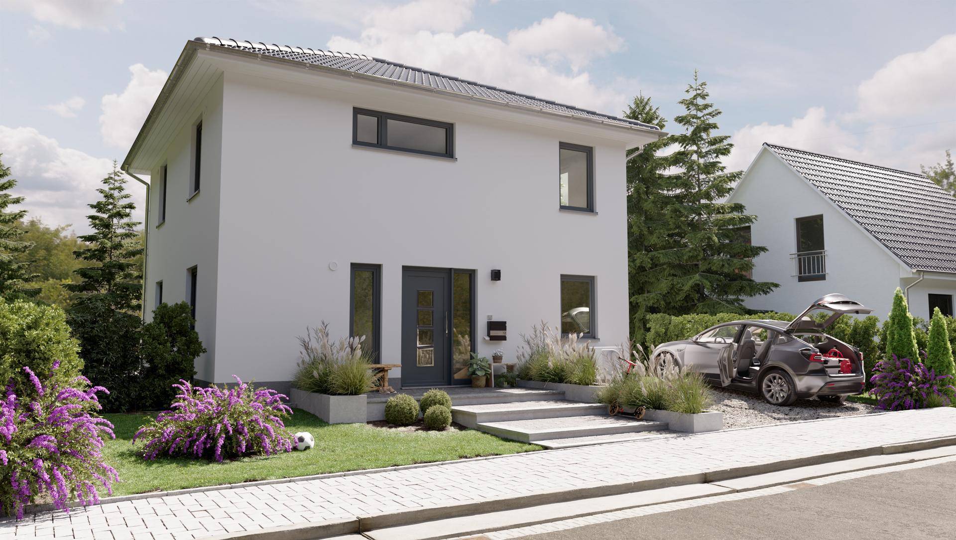 Modernes Einfamilienhaus mit weißer Fassade, dunklen Fenstern und gepflegtem Vorgarten.