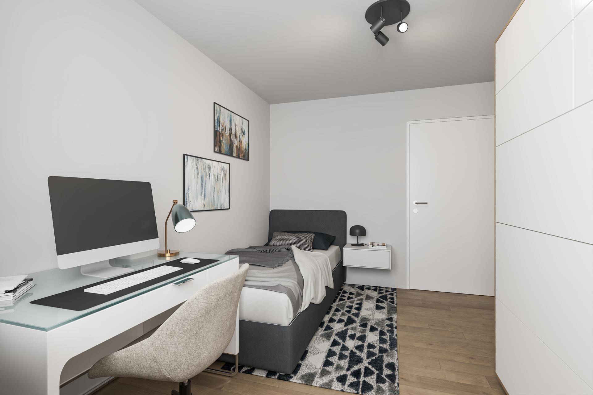 Funktionales Schlafzimmer mit Einzelbett, modernem Schreibtisch und ausreichend Stauraum im Kleiderschrank.