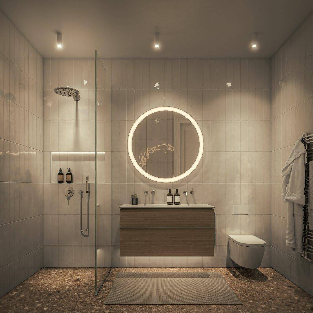 Modernes Badezimmer mit begehbarer Dusche, beleuchtetem Spiegel, Wand-WC und hochwertigen Fliesen.