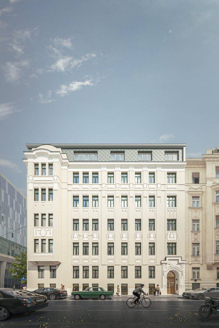 Elegante historische Fassade eines Stadthauses mit aufwendigen Verzierungen und modernem Dach.