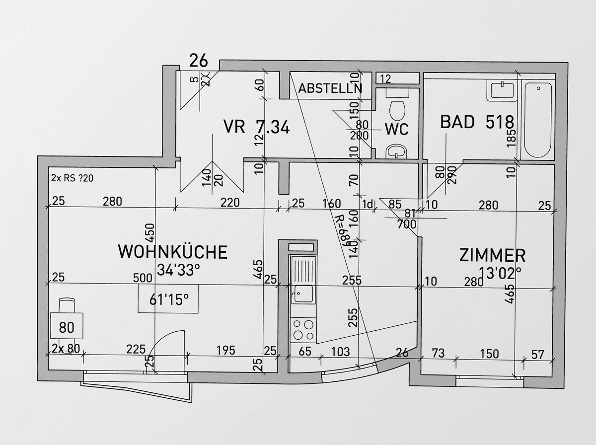 Grundriss einer Wohnung mit Wohnküche, Bad, WC und einem weiteren Zimmer.