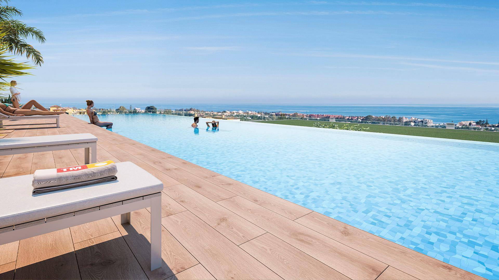 Atemberaubender Infinity-Pool mit Holzdeck und Panoramablick auf das Meer und die Küste.
