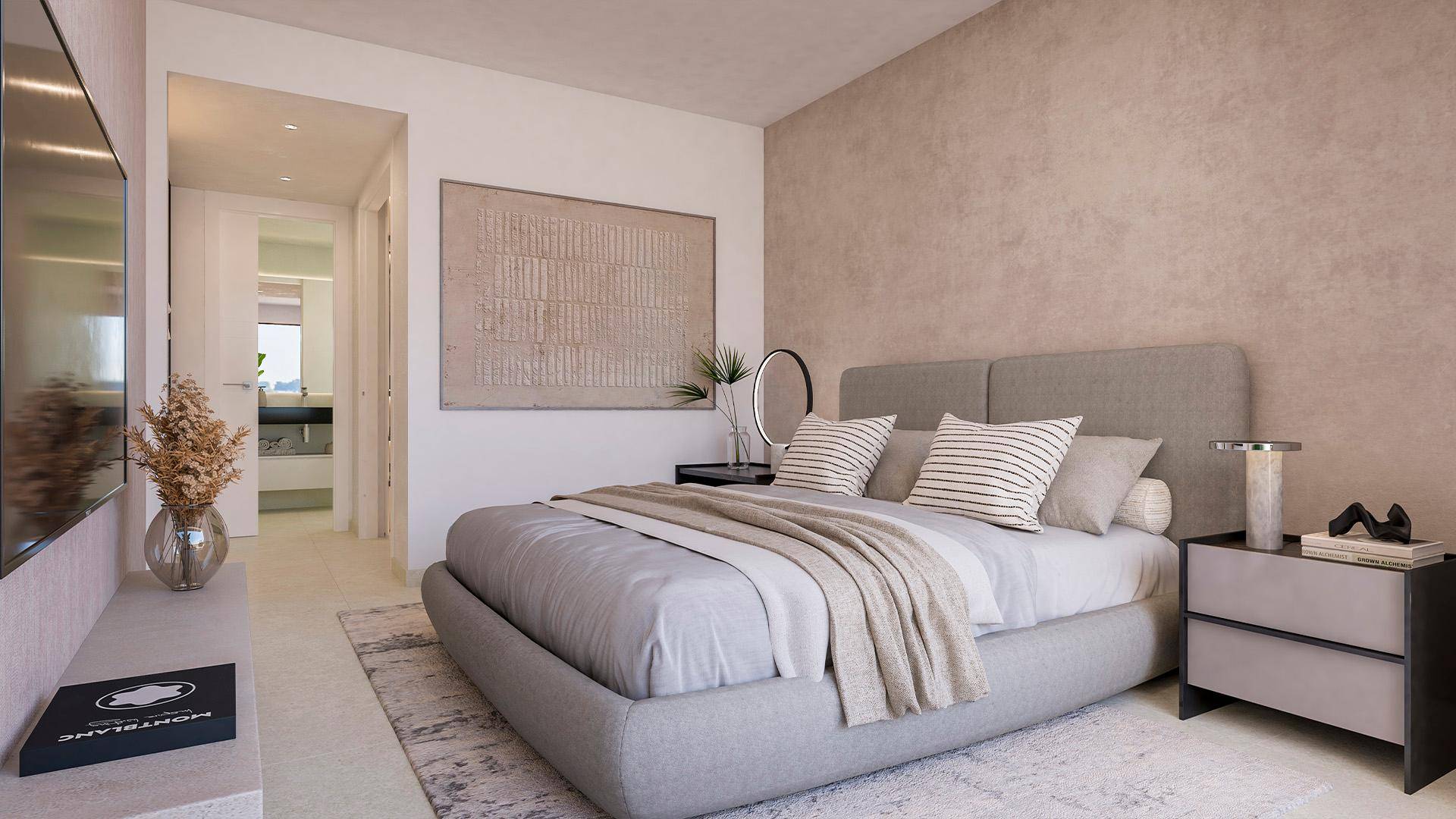 Ruhiges Schlafzimmer mit Doppelbett, moderner Einrichtung und Zugang zum Badezimmer.