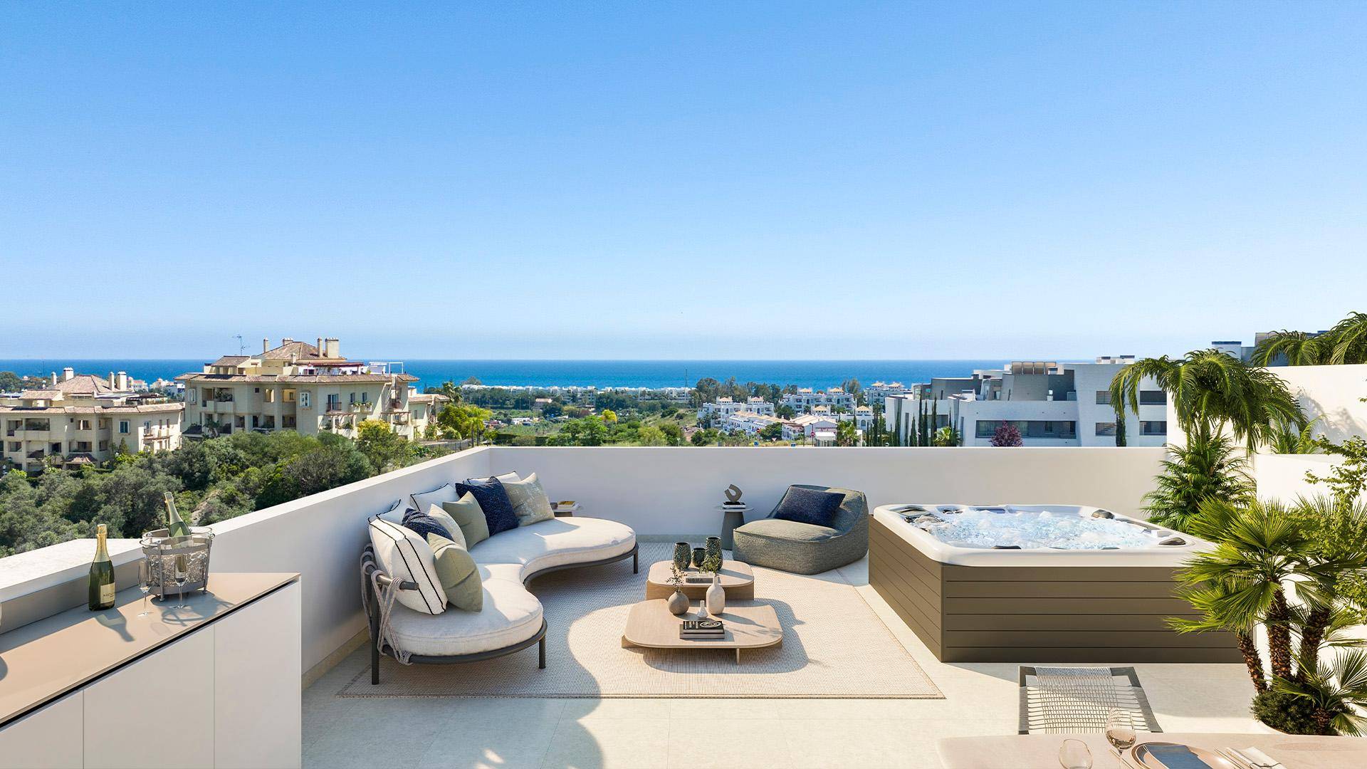 Exklusive Dachterrasse mit Whirlpool, stilvollen Loungemöbeln und weitem Meerblick.