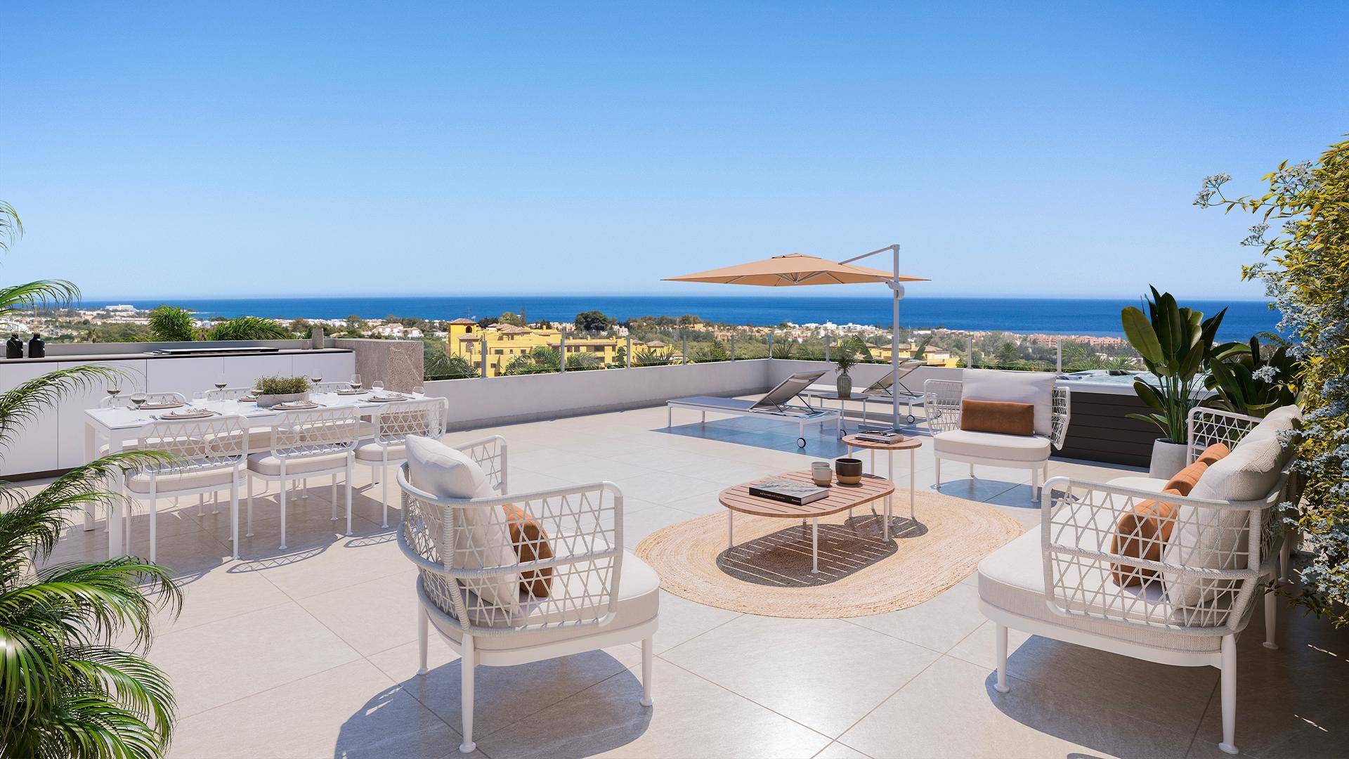 Geräumige Dachterrasse mit Essbereich, Sonnenliegen und Lounge-Möbeln mit Meerblick.