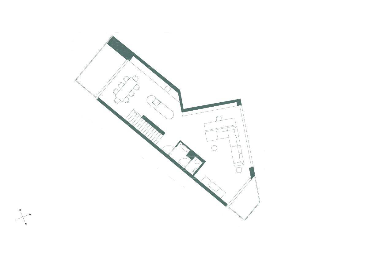 Grundriss einer Wohnung mit offenem Wohn-, Ess- und Küchenbereich sowie einem Gäste-WC.
