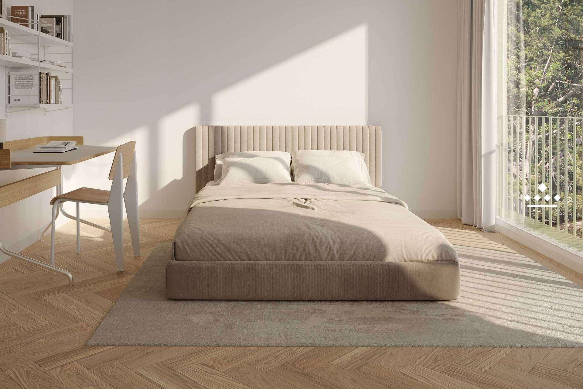 Helles Schlafzimmer mit modernem Bett, Schreibtisch und großen Fenstern mit Blick ins Grüne.