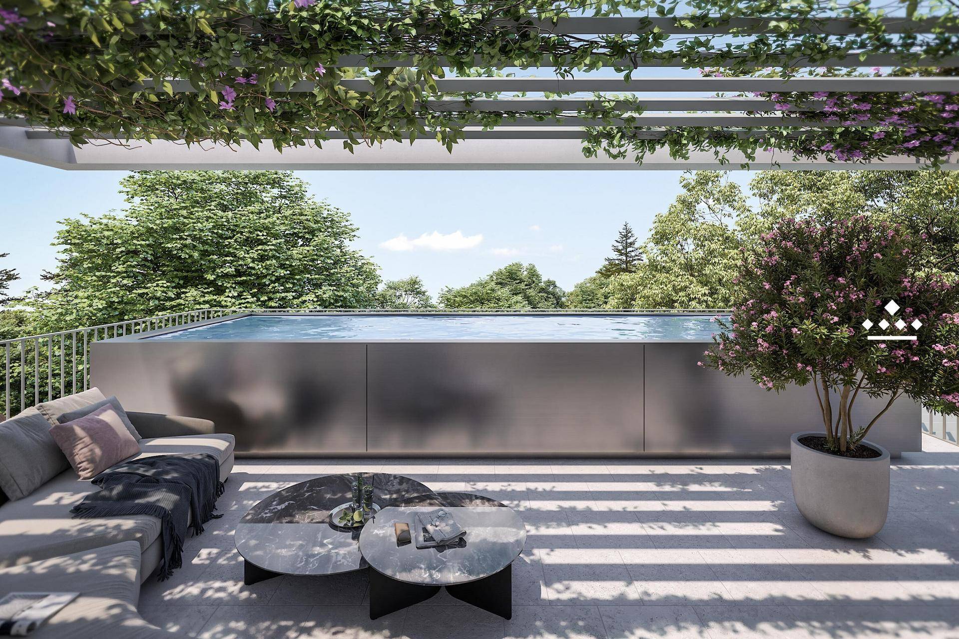Dachterrasse mit Infinity-Pool, Lounge-Möbeln und weitem Blick ins Grüne.