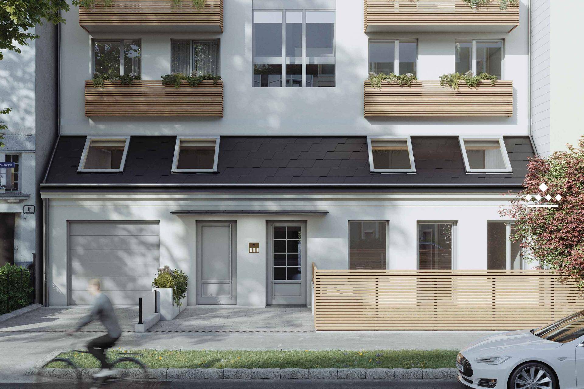 Moderne Gebäudefassade mit Balkonen, Garagentor und gepflegtem Vorgartenbereich an einer Straße.