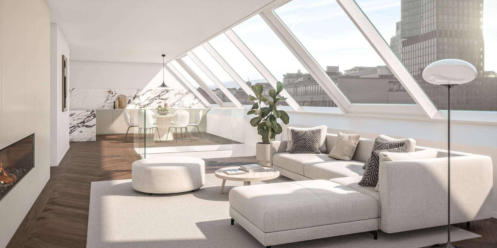 Heller Wohn- und Essbereich mit Dachschrägenfenstern, Kamin und moderner Einrichtung.