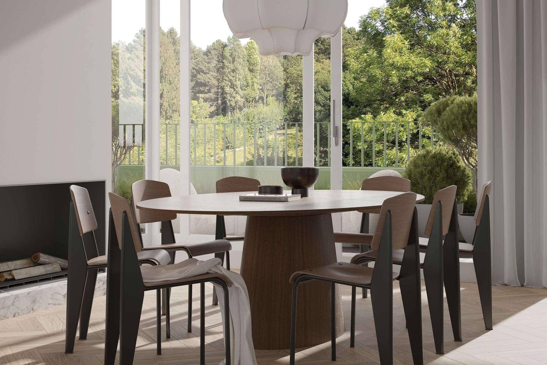 Eleganter Essbereich mit Holztisch, Kamin und großzügigem Blick ins Grüne.