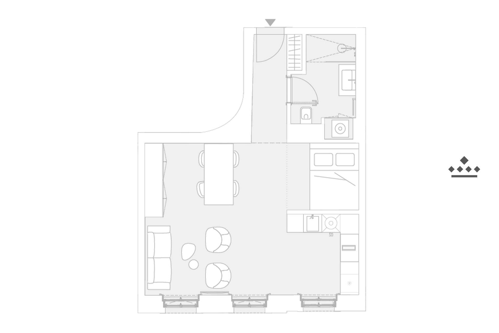 Grundriss einer kompakten Wohnung mit offenem Wohnbereich, Schlafzimmer und separatem Bad.