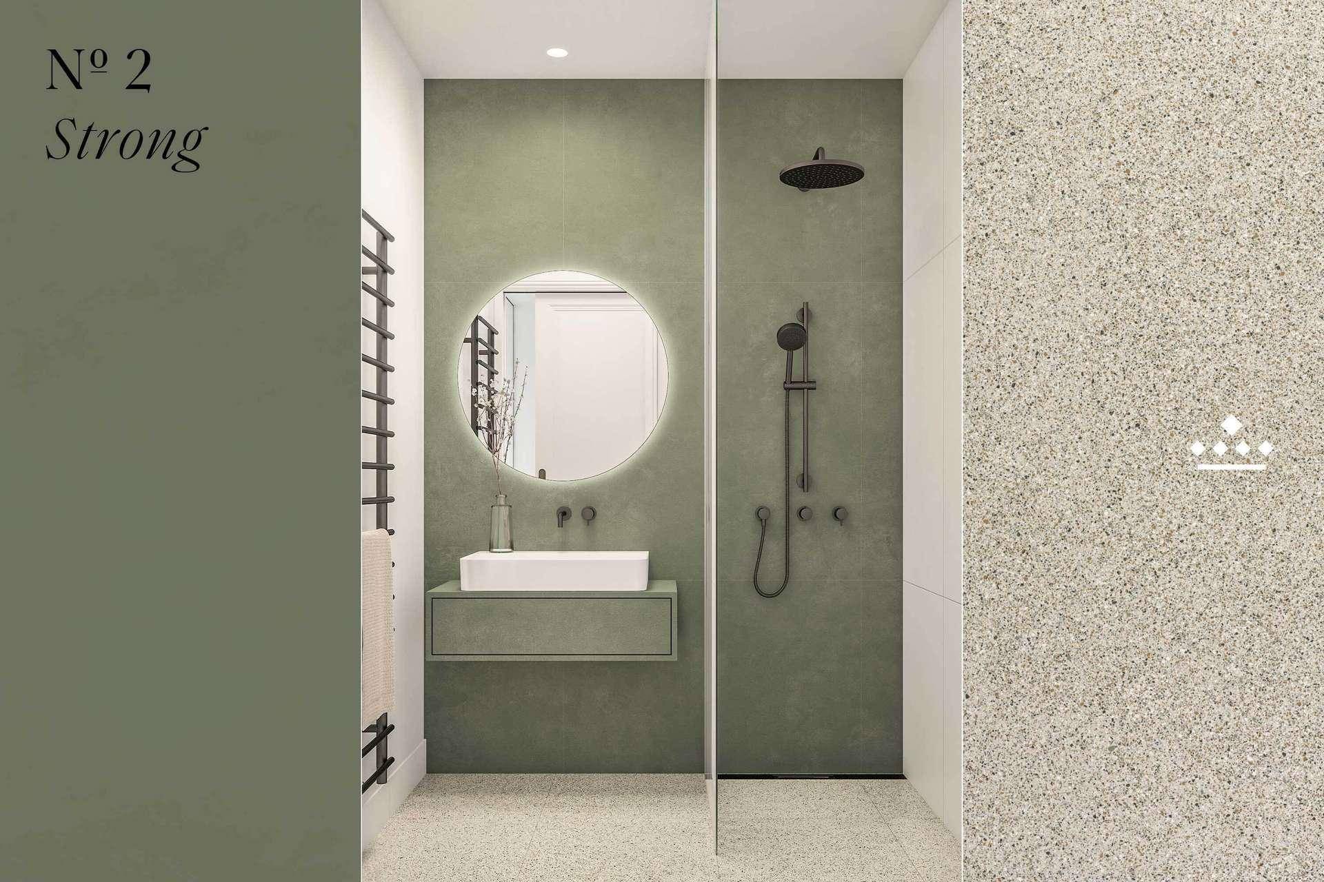 Modernes Badezimmerdesign "N° 2 Strong" mit grünen Wänden, heller Duschkabine und runder Spiegelleuchte.