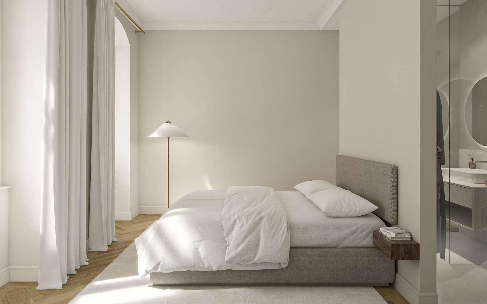 Modernes Schlafzimmer mit hellem Parkettboden und offenem Übergang zu einem eleganten Badezimmer.