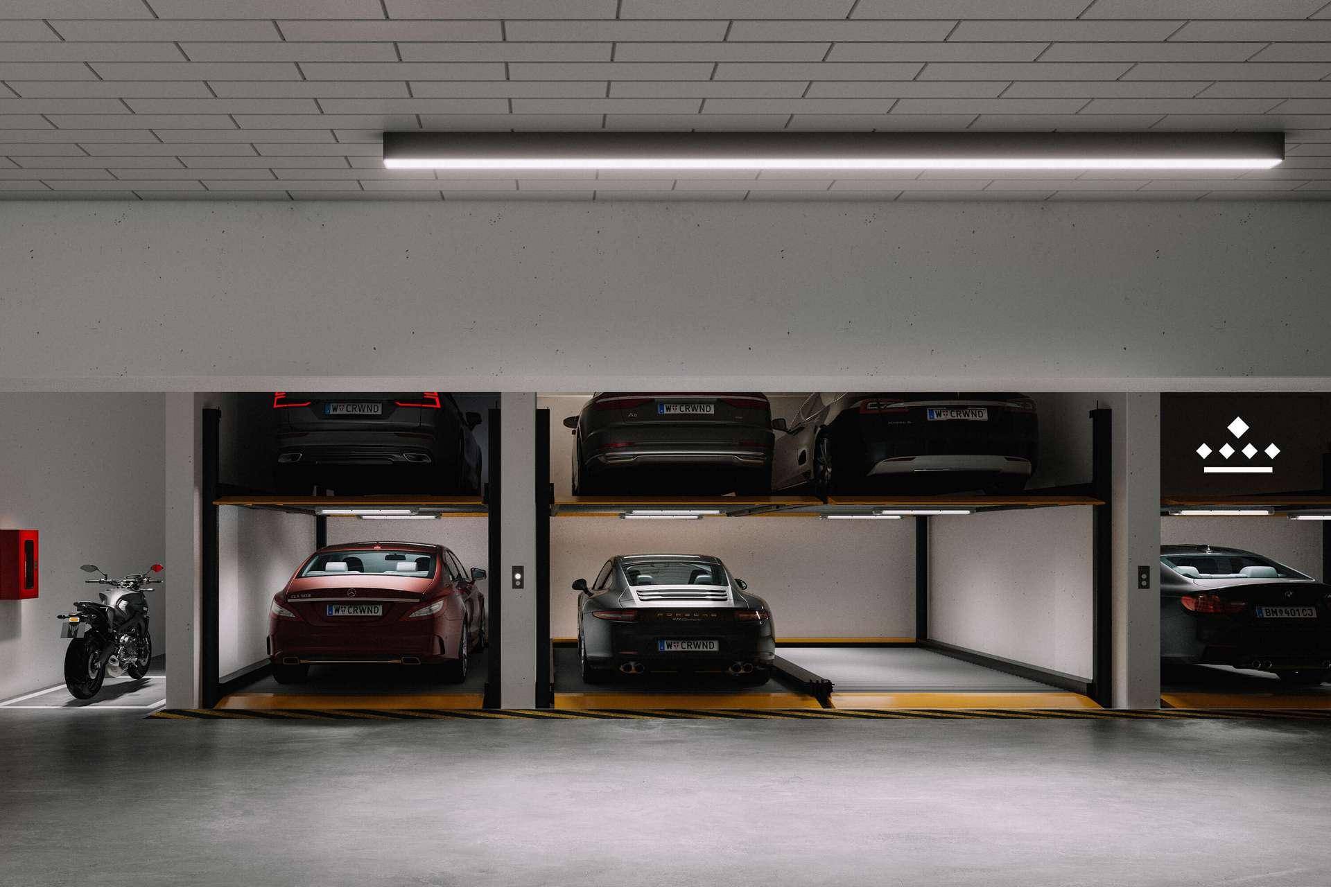 Moderne Tiefgarage mit automatischen Parksystemen für mehrere Fahrzeuge.