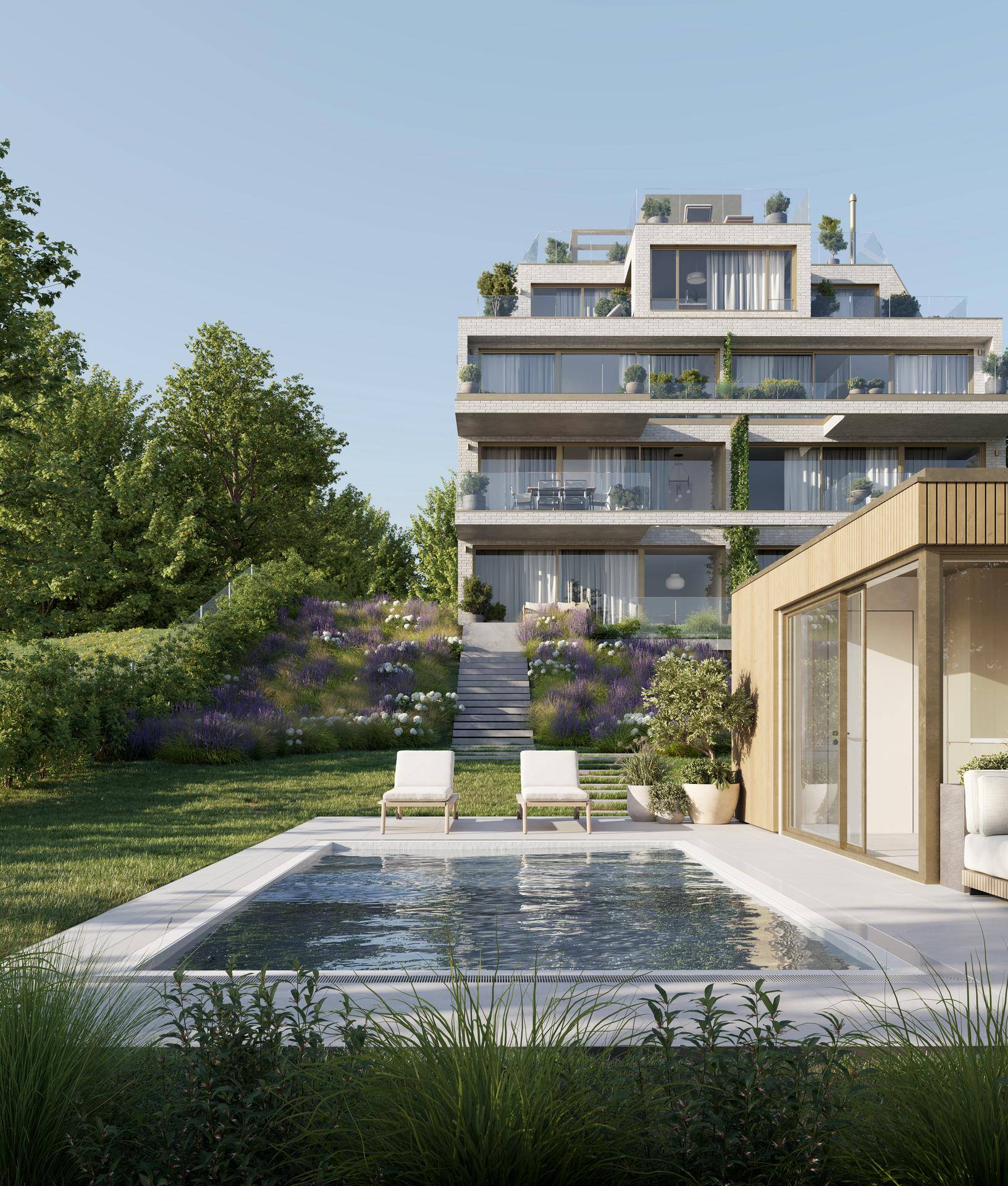 Modernes Apartmentgebäude mit einem eleganten Swimmingpool und gepflegtem Gartenbereich.