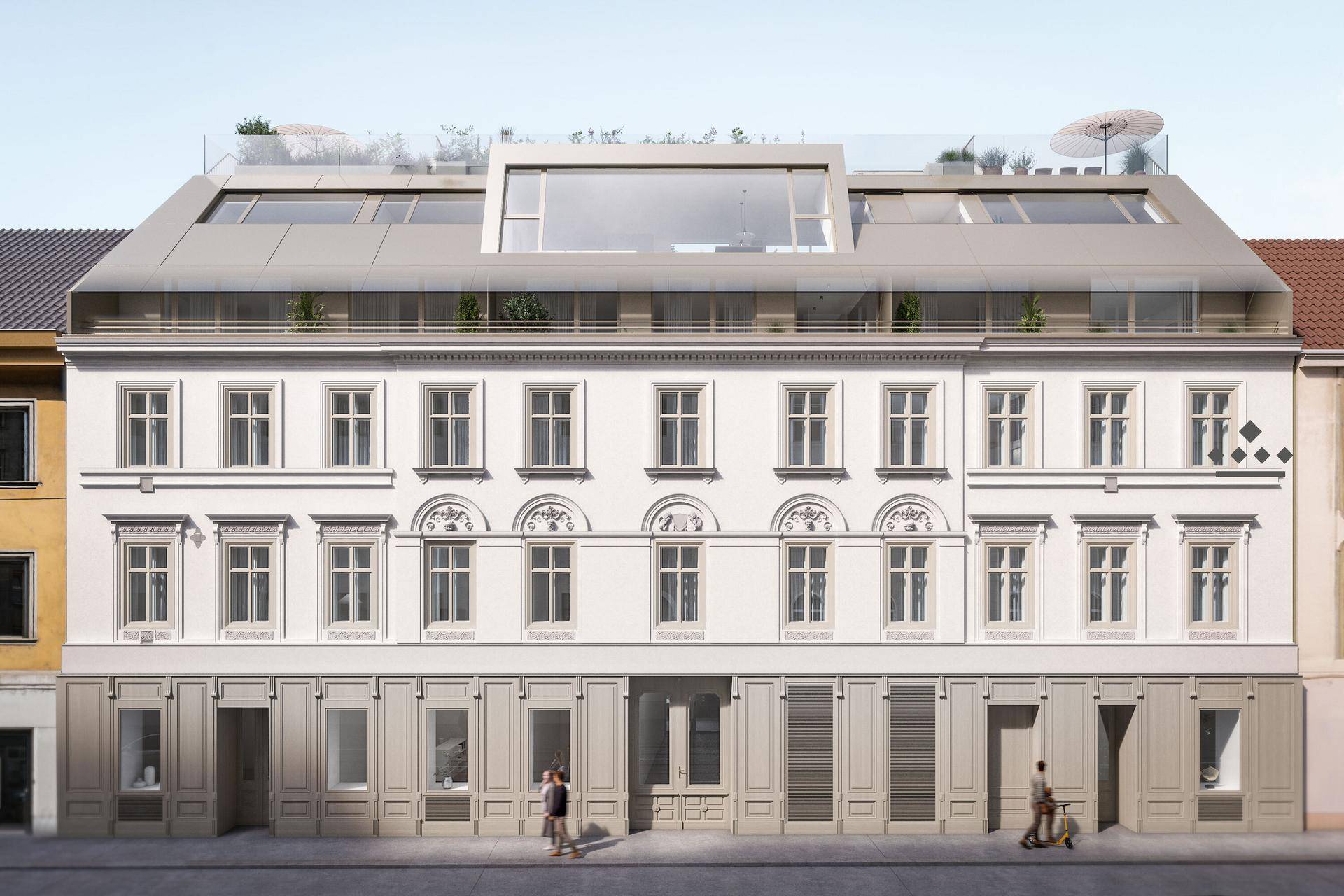 Historisches Gebäude mit moderner Dachaufstockung und eleganten Fassadendetails in der Stadt.