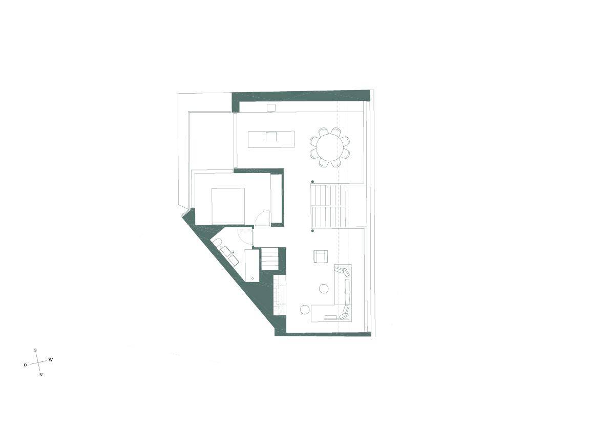Grundriss einer Wohnung mit offenem Wohnbereich, Küche und Schlafzimmer.