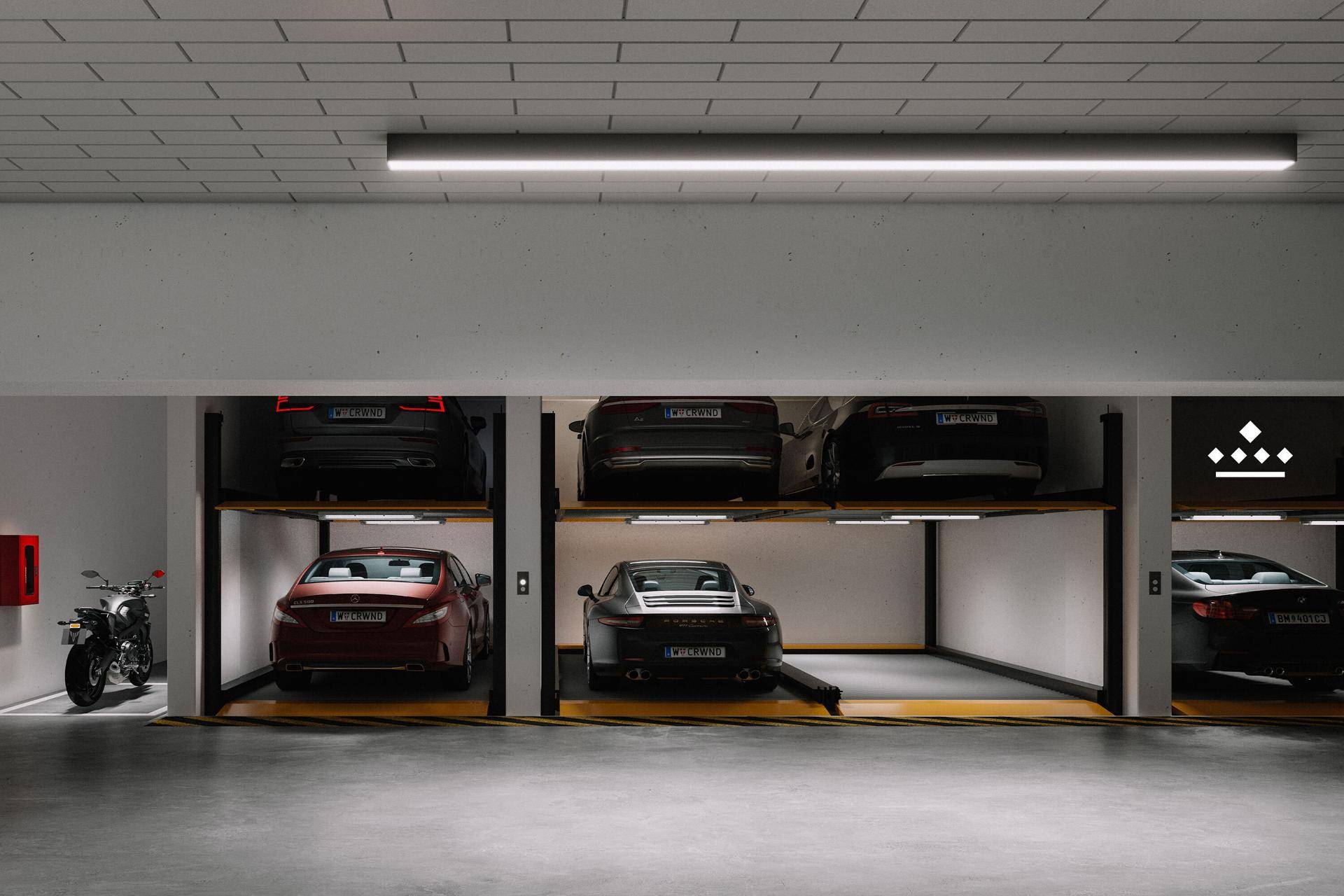 Moderne Tiefgarage mit automatischen Parksystemen und mehreren Fahrzeugen, effizient und platzsparend.