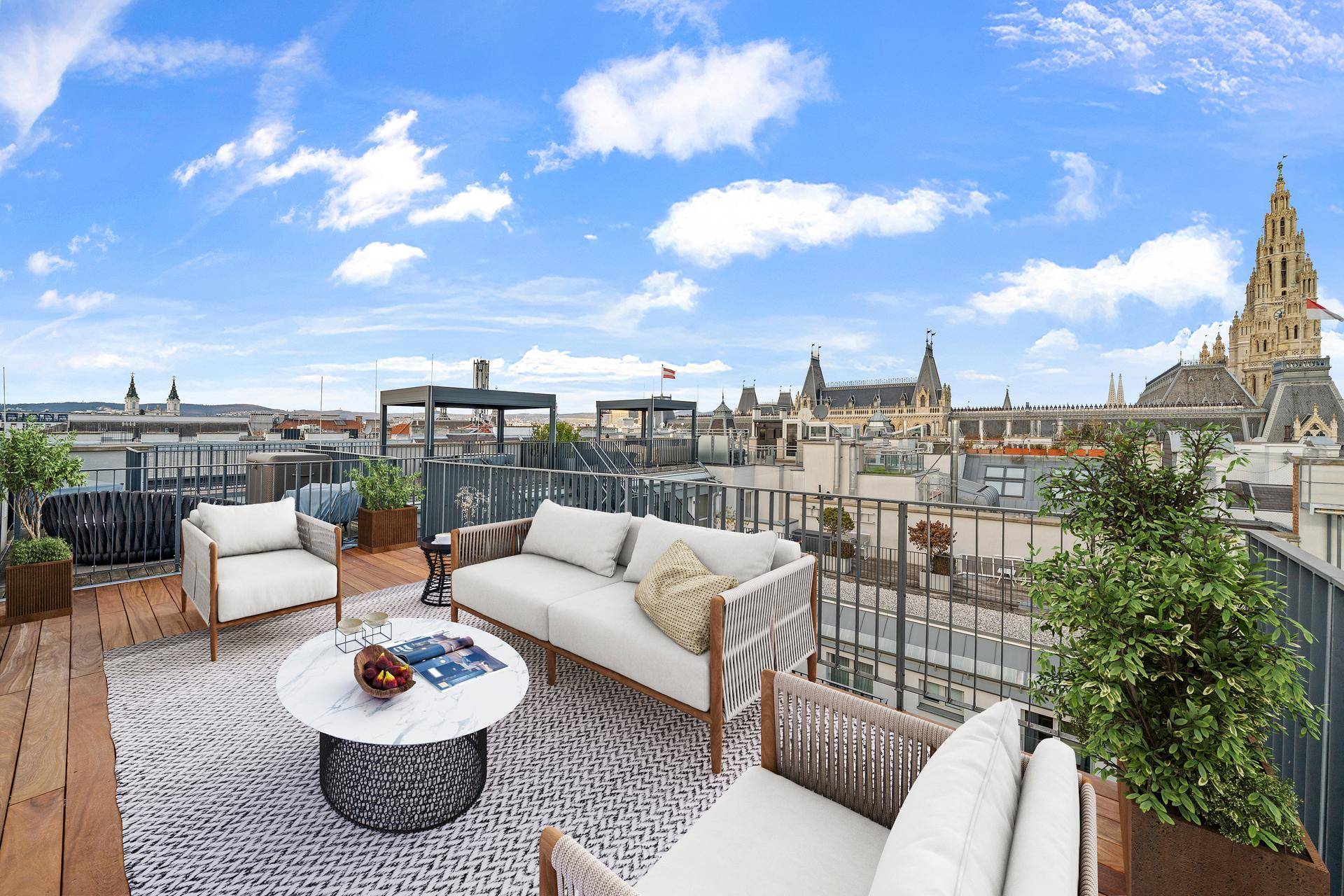 Geräumige Dachterrasse mit bequemen Loungemöbeln und weitem Blick über die Stadt.