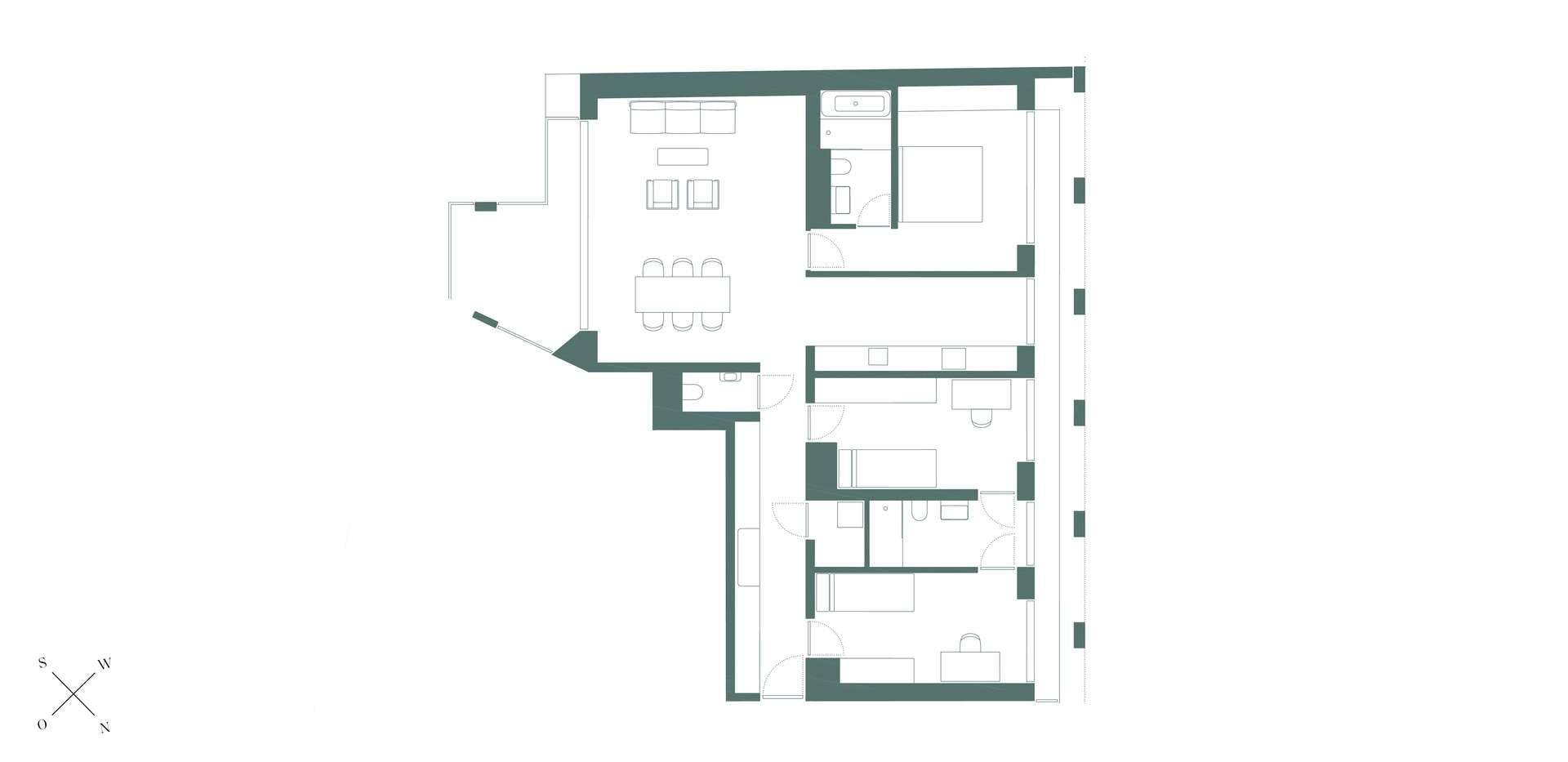 Grundriss einer Wohnung mit offenem Wohnbereich, Schlafzimmer und weiteren Räumen.
