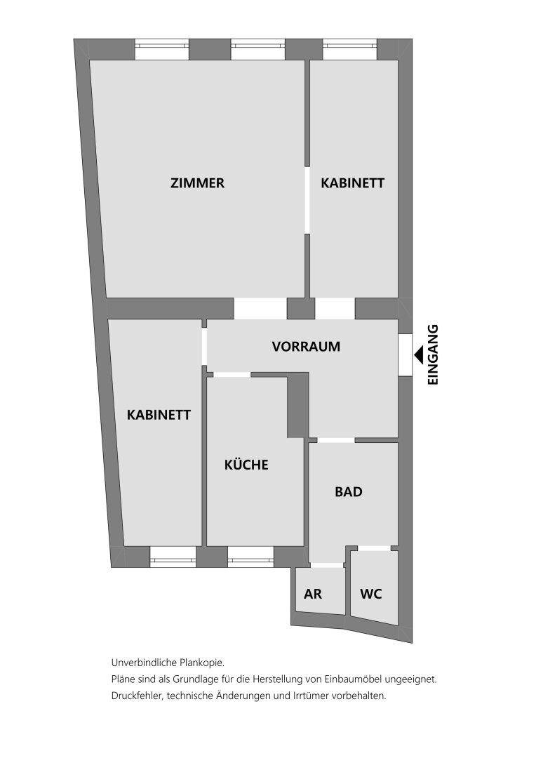 Grundriss einer Wohnung mit mehreren Zimmern, Küche, Bad und separatem WC.