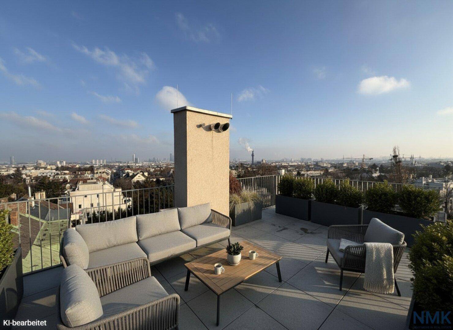 Große Dachterrasse mit modernen Loungemöbeln und weitem Blick über die Stadt.