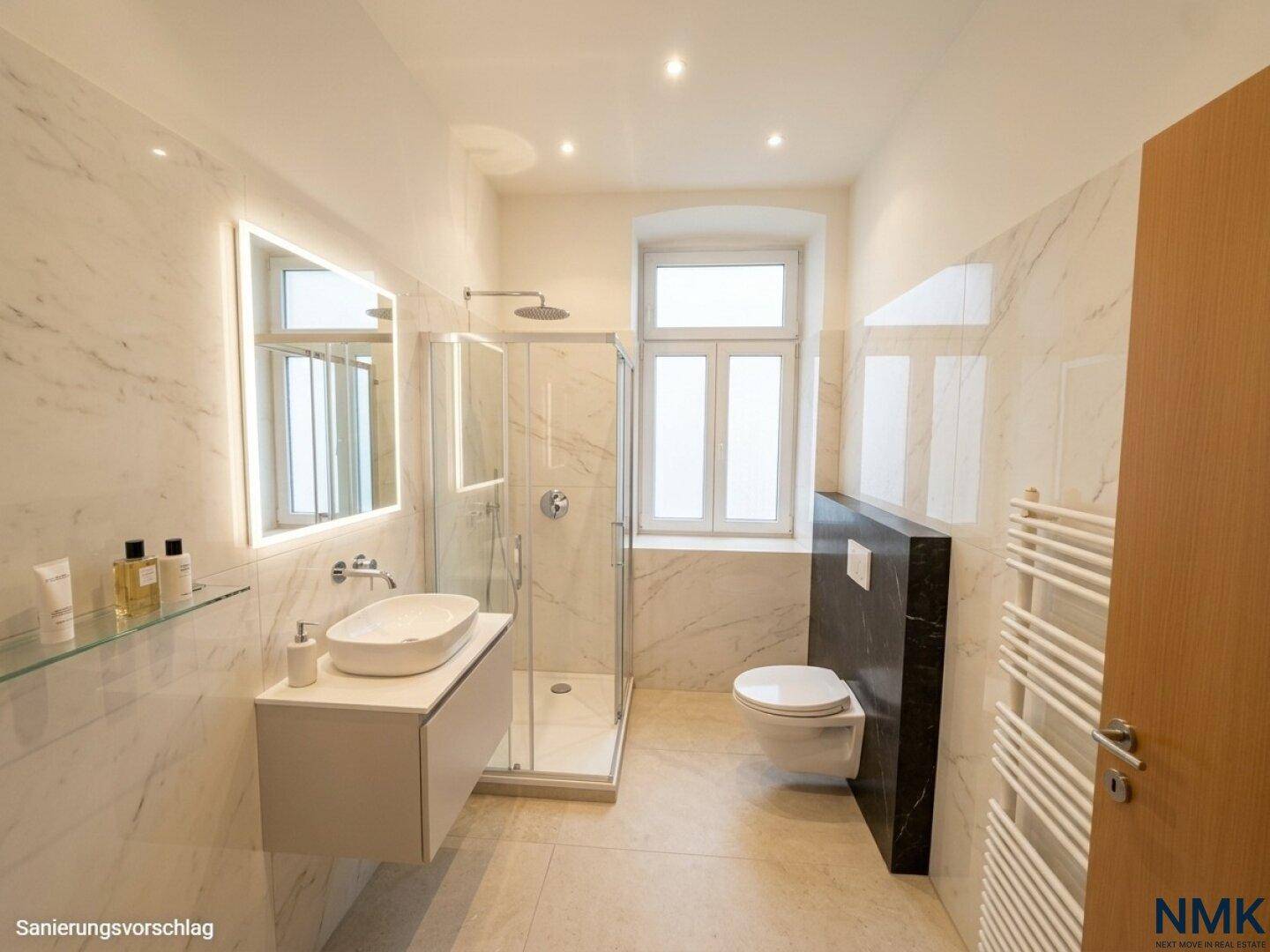Modernes Badezimmer mit Marmorfliesen, ebenerdiger Dusche, Wand-WC und beheiztem Handtuchhalter.