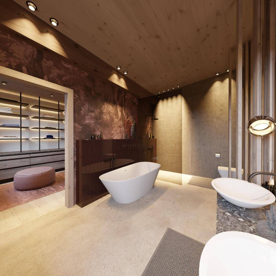 Luxuriöses Badezimmer mit freistehender Badewanne, Doppelwaschbecken und Zugang zum Ankleidezimmer.