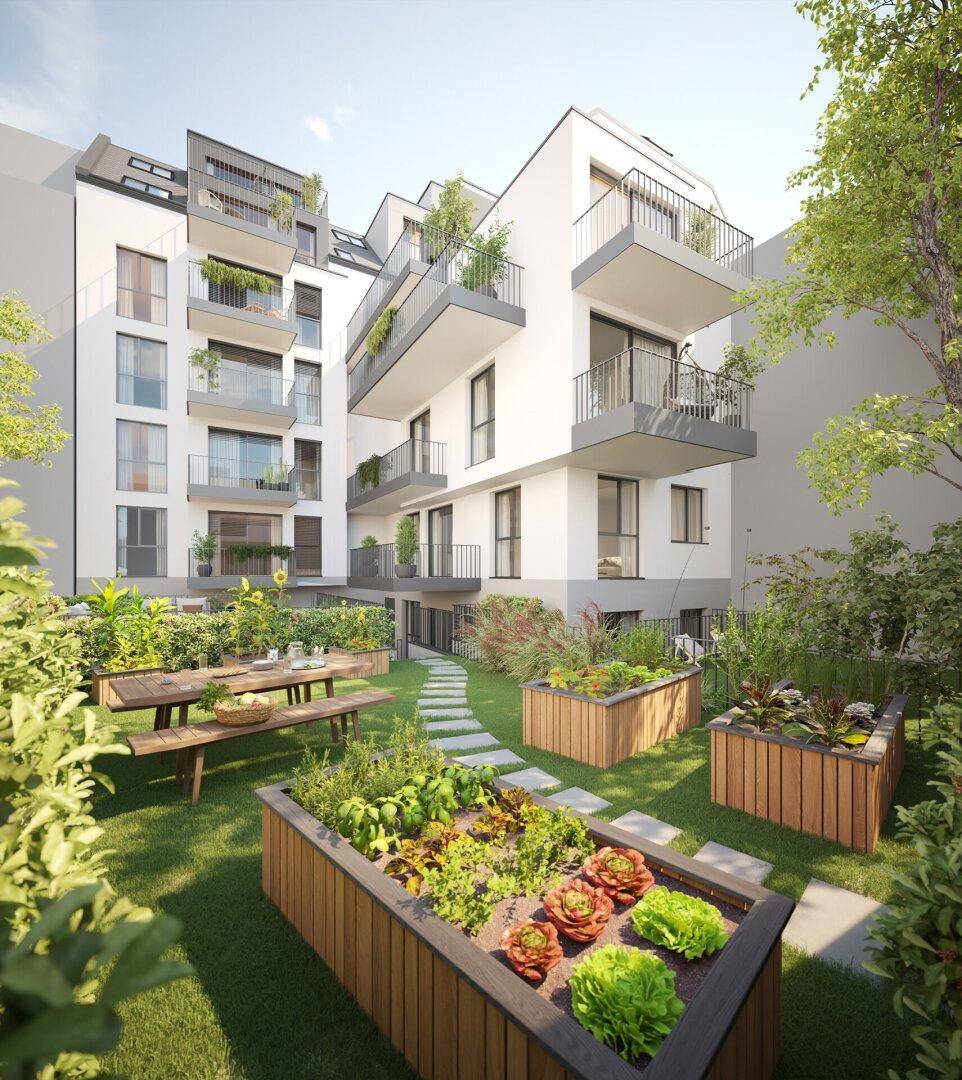 Gepflegter Gemeinschaftsgarten mit Hochbeeten für Gemüseanbau und Sitzgelegenheiten.