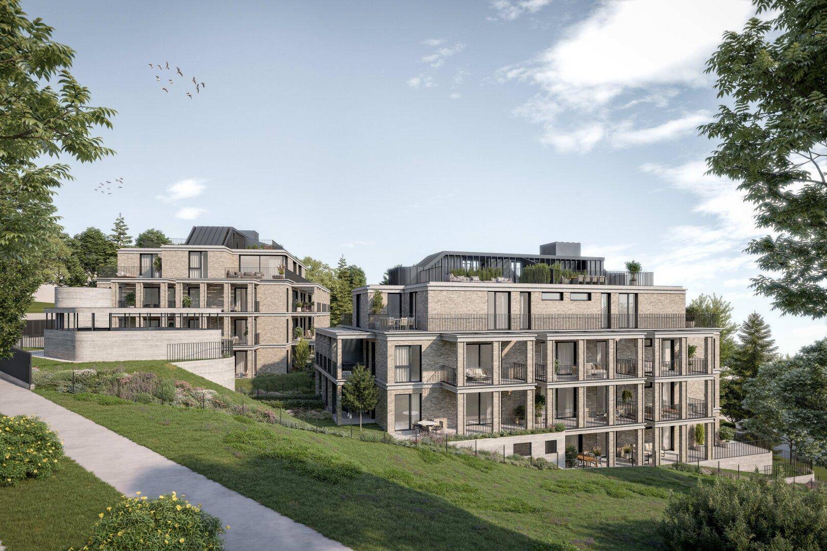 Moderne Wohngebäude in einer grünen Hügellandschaft mit Terrassen und Balkonen.