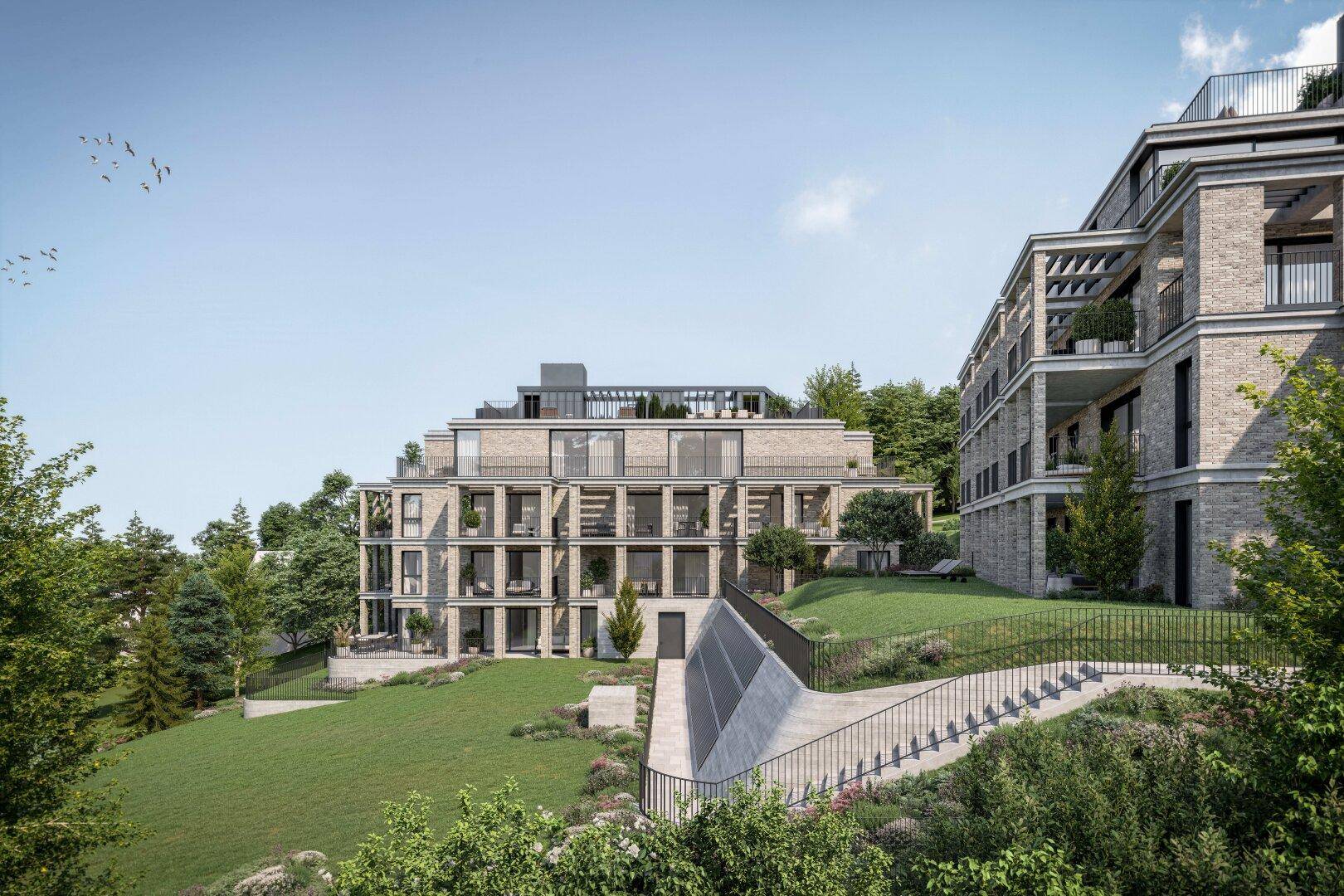 Architekturvisualisierung eines modernen Wohnkomplexes eingebettet in eine natürliche Umgebung.