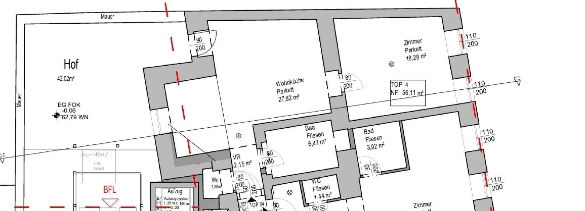 Detaillierter Grundriss einer Wohnung mit Wohnküche, Bädern und Zimmern.