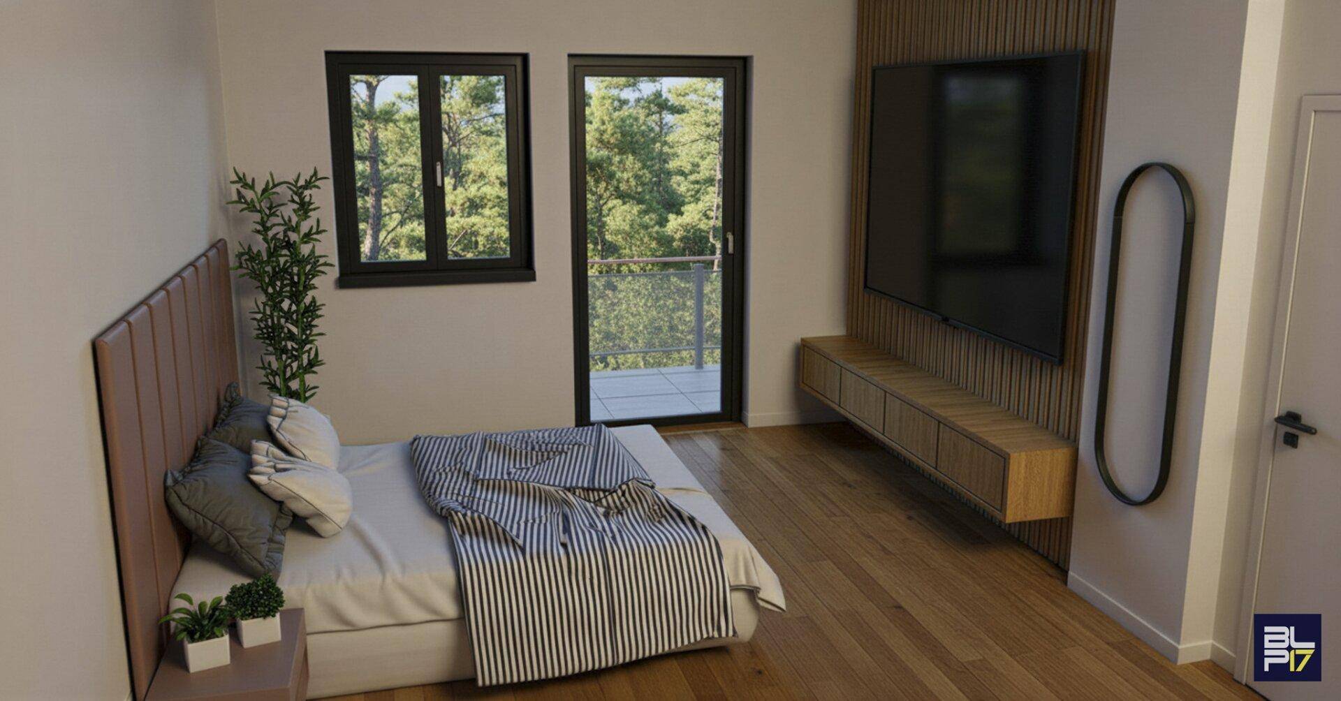 Modernes Schlafzimmer mit Holzboden, großem Bett und Blick ins Grüne.