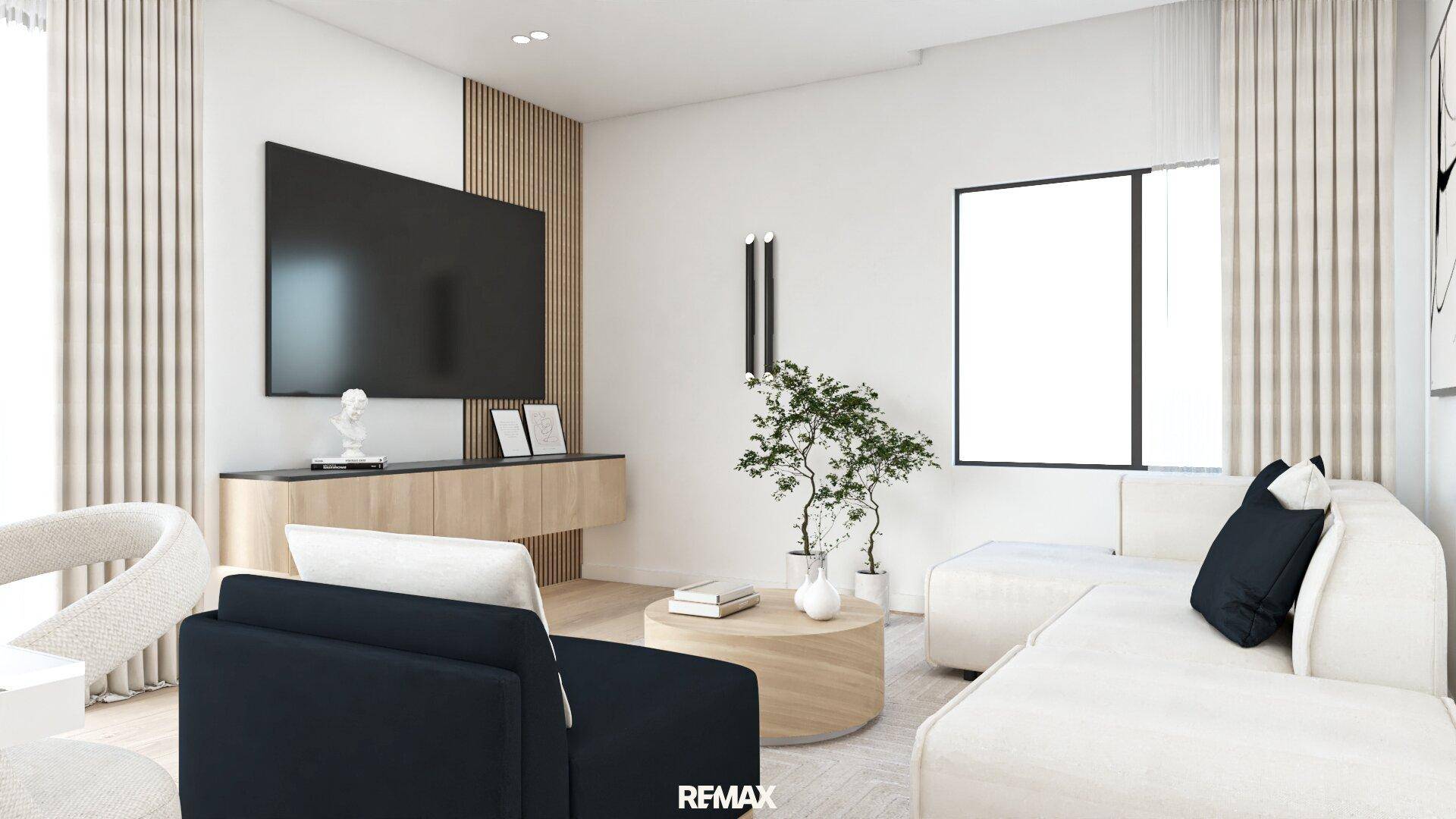 Modernes Wohnzimmer mit großem Fernseher, bequemen Sofas und stilvoller Dekoration.